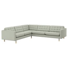 a large sectional couch sitting on top of a white floor