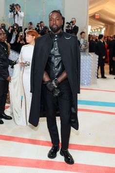 The 2023 Met Gala Celebrating "Karl Lagerfeld: A Line Of Beauty" - Arrivals D Wade, A Line Of Beauty, Burberry Suit, Dwayne Wade, Pink Tweed Jacket, Leather Biker Vest, Patent Leather Oxfords, Baz Luhrmann, Painted Sneakers