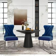 two blue chairs sitting at a round table