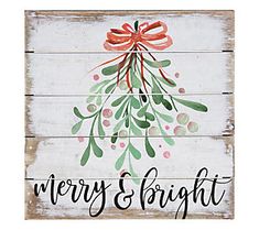 a wooden sign that says merry and bright with a red bow on top of it