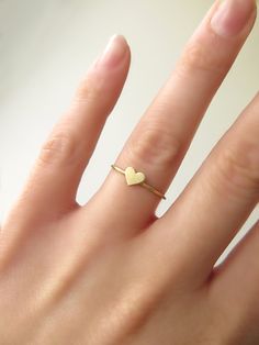 14K 9K Solid Gold Heart Ring, Delicate gold ring, Dainty Rose Gold heart ring, Love Romatnic Jewelry, Minimalist Stacking gold ring, Gift for her, Stackable gold ring, 14K rose gold ring, 9K rose gold ring, 9K gold ring, FREE EXPRESS SHIPPING Dainty 14K or 9K solid gold ring with a tiny heart. Love is always around, hear its whispers and embrace it. <3 More dainty gold rings here: https://www.etsy.com/shop/WhisperGold?ref=seller-platform-mcnav&section_id=23760120 ------------------------- Delicate 14k Gold Heart Ring For Everyday, Delicate Everyday 14k Gold Heart Ring, Delicate Heart Ring For Everyday Valentine's Day, Delicate Everyday Heart Ring In 14k Gold, Minimalist Midi Rings For Wedding And Valentine's Day, Minimalist Midi Rings With Heart Charm For Wedding, Delicate Everyday Heart Ring For Valentine's Day, Tiny Gold Heart Promise Ring, Dainty Gold Heart Ring For Everyday