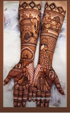 two hands with henna designs on them