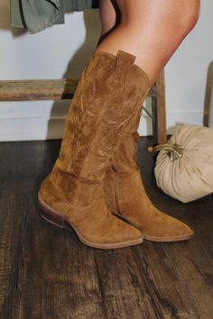 We are so excited to carry these adorable knee high cowboy boots! These Tan Suede Boots are perfect to pair with dresses, tops and tees or even skirts! A must have for fall! Color: Tan (suede) Knee High Runs True To Size Western Boots Fall 2022, Short Tan Western Boots, Natural Cowboy Boots, Tan Ankle Boots Dress, Fall Boots With Matching Bags, Outdits With Tall Cowboy Boots For Work, Tan Boots Dress, Boots For Fall Photoshoot, Tan Suede Western Ankle Boots