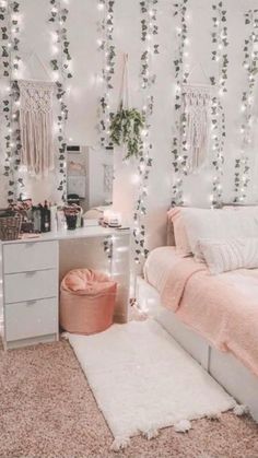 a bedroom with lights strung from the ceiling