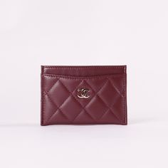 * Burgundy Quilted Lambskin Leather* Silver-Tone Hardware * Interlocking CC Accent at Front Face* Four Card Slots* Tonal Stitching * Dimensions: L 4.3" x H 3" Ysl Card Holder Hearts, Luxury Classic Red Card Holder, Burgundy Car, Chanel Card Holder, Dream Wishlist, Red Chanel, Front Face, Classic Card, Car Holder