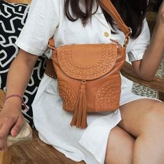 Looking for the perfect Boho handbag to take with you on all your adventures? Meet our stylish Boho Traveler Crossbody Bag! A jewel of artisan creation, this superb bohemian crossbody bag made of high-quality sheepskin leather features elegant hand-woven ornamental details for a genuine vintage bohemian feel and a Wild Boho vibe! ~ We love the stylish design of intricate handwoven patterns, the softness of genuine sheep leather and the long tassel on the flap, adding a touch of authenticity and Bohemian Crossbody Saddle Bag For Everyday Use, Bohemian Shoulder Bag With Detachable Strap For Travel, Bohemian Brown Satchel For On-the-go, Bohemian Satchel Saddle Bag For Travel, Bohemian Crossbody Travel Satchel, Bohemian Saddle Shoulder Bag For Travel, Bohemian Crossbody Satchel For Travel, Bohemian Travel Satchel With Detachable Strap, Bohemian Satchel With Removable Pouch For On-the-go