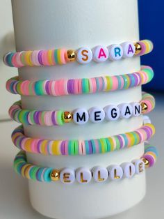 "BULK ORDERS You can make different designs for each bracelet. In bulk orders and special days, production and cargo delivery may take a long time. Therefore, it is better to order 15 days in advance. Bead Letter Colors White W/Silver Letter/Silver filled White W/Black Letter/Gold filled White W/Gold Letter/Gold filled White W/Multicolor Letter /Gold filled Multicolor circle/Gold filled White W/ Black Number White W/Gold Number Black W/White Number  Ready to ship in 1 pcs - 50 pcs 3-5 business d Ts Bracelet, Album Bracelets, Friendship Bracelets Eras Tour, Bracelets Eras Tour, Eras Tour Friendship Bracelets, Mama Bracelet, Sorority Sisters, Moms Bracelet, Gold Number