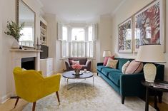 a living room filled with furniture and a fire place