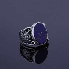 Men's Lapis Lazuli gemstone signet ring which will give you a head turning presence. This mystic, vintage style, engraved ring has a unique design for the polished, refined, and distinguished man. Perfect for casual and formal events, it will make your friends envious as you walk into the room full of confidence and pride. CUSTOMIZATION: I can make the same ring of 18K GOLD or 22K GOLD with the same Lapis gemstone at an EXTRA COST. Please contact me for details if you're interested. Ring Details Engraved Round Sapphire Jewelry, Symbolic Gemstone Rings For Formal Occasions, Formal Lapis Lazuli Gemstone Ring, Symbolic Gemstone Jewelry For Formal Occasions, Formal Silver Lapis Lazuli Jewelry, Formal Lapis Lazuli Ring Jewelry, Silver Lapis Lazuli Jewelry For Formal Events, Silver Lapis Lazuli Jewelry For Formal Occasions, Symbolic Engraved Gemstone Ring