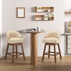 two stools sit at a small table in front of a wall mounted bookcase