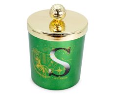 a green and gold canister with a golden s on it