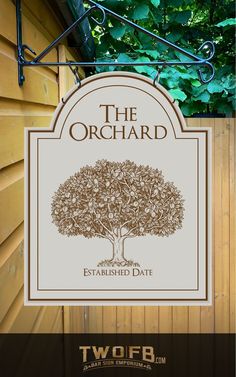 a sign for the orchard is hanging outside