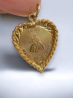 "Vintage 14K Yellow Gold HEART \"Maid of Honor\" Charm Pendant Unique Bridal Gift! * This pretty vintage charm pendant is crafted of solid 14k yellow gold with great detail! in nice vintage condition!  * This vintage estate piece \"To My Maid of Honor\" charm would be a special and unique gift for bride to give! * Rope edging * Measures approximately 1' x 3/4\" with bale * 14K Yellow gold * Weighs 1.7 Grams Shipped FAST and FREE, insured/delivery confirmation I guarantee item to be exactly as de Victorian 14k Gold Jewelry For Valentine's Day, Collectible Gold Jewelry With Heart Charm, Victorian Gold Jewelry For Anniversary Gift, Collectible Yellow Gold Necklace With Heart Charm, Collectible 14k Gold Heart-shaped Jewelry, Collectible Gold Heart Pendant Jewelry, Gold Jewelry For Valentine's Day Collectible, Vintage 14k Gold Jewelry For Valentine's Day, Vintage 14k Stamped Necklace For Commemoration