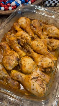 some chicken is sitting in a glass dish