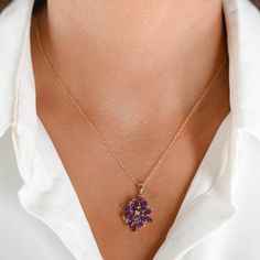 This enchanting 14K Yellow Gold Amethyst and Diamond Flower Charm Rolo Link Necklace is a stunning addition to any jewelry collection. Featuring a beautifully crafted flower charm adorned with vibrant amethyst and sparkling diamonds, this necklace exudes elegance and charm. Weight: 4.1gMaterial: 14K Yellow GoldLength: 18"Width: 1 mmClosure: Spring Ring ClaspPendant: 1" x 0.7" Diamonds: 1 = 0.01CtwColor And Clarity: H/I1Amethyst: 14 x 0.10Ctw = 1.40CtwTotal Carat Weight: 1.41Ctw For more of our jewelry products, please visit our shop 777jewelryLA Free shipping on all orders within USA.International shipping available. We only sell real gold jewelry. We do not sell gold plated or gold filled jewelry. We offer a 30 day money back guaranteed return on all orders. Our goal is to make every cust Elegant Flower Shaped Amethyst Jewelry, Purple Gemstone Flower Pendant Necklace, Purple Jewelry With Flower Charm And Pendant, Purple Jewelry With Flower Pendant And Charm, Purple Flower Pendant Jewelry With Charm, Purple Flower Shaped Gemstone Jewelry, Purple Flower Charm Jewelry, Elegant Purple Flower-shaped Necklace, Purple Flower Pendant Necklace