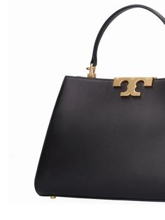 Height: 21cm Width: 32cm Depth: 12.8cm. Strap drop: 41cm. Top handle drop: 11cm. Detachable leather strap. Single leather top handle. Top clasp closure. Front logo detail. Lined Leather Tote Bag Women, Black Leather Tote Bag, Tory Burch Bags, Tory Burch Bag, Black Tote Bag, Leather Tote Bag, Leather Top, Womens Tote Bags, Leather Tote