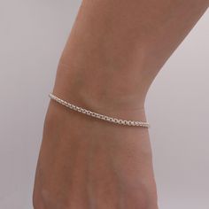 Indulge in the timeless allure of our handcrafted 925 Sterling Silver Bracelet. This exquisite piece is meticulously crafted to add a touch of elegance to your everyday style. Expertly designed with a delicate and dainty band, this bracelet exudes understated charm that effortlessly complements any outfit. What sets this bracelet apart is its exceptional quality and durability. Made with 925 sterling silver, it offers a lustrous and luxurious appeal that stands the test of time. The sterling silver material ensures a tarnish-resistant finish, allowing the bracelet to maintain its radiant shine for years to come. With its versatile design, this bracelet is perfect for stacking with others or wearing on its own for a minimalist look. Whether you're attending a special occasion or simply goin Timeless Polished Sterling Silver Bracelet Gift, Timeless Sterling Silver Bracelet Gift, Timeless Everyday Bracelet With Sterling Silver Clasp, Classic Sterling Silver Oyster Bracelet As Gift, Minimalist Formal Bracelets With Sterling Silver Clasp, Classic Sterling Silver Chain Bracelet, Everyday Sterling Silver Box Chain Bracelet, Minimalist Formal Bracelet With Sterling Silver Clasp, Classic Sterling Silver Bracelet With Silver Chain For Everyday