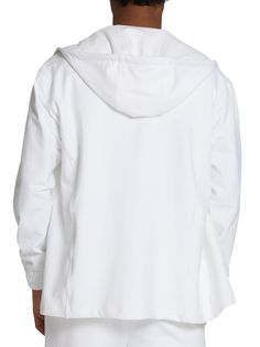 This white long-sleeved zip-up hoodie comes in cotton, a fabric that has been taken from our shirting fabric archive. This iconic sporty-chic garment was created from a need to offer the Kiton man a comfortable and laid-back wardrobe that travels well, folded in his suitcase and not in garment bags. This garment has two patch pockets on the front, stretch inner cuffs, and a straight hem without slits. The hood features an adjustable herringbone cotton drawstring with the Kiton logo laser-etchedon an aglet. This sweatshirt style features a tone-on-tone inner placket and underarm panel. Regular fit. Quality, simplicity and exclusivity: this garment requires six hours of craftsmanship and 22 artisanal steps all performed at our Naples workshop. To keep your Kiton hoodie looking flawless, we r Modern White Sweatshirt With Ribbed Cuffs, Cotton Hooded Jacket With Ribbed Cuffs For Spring, Spring Cotton Hooded Jacket With Ribbed Cuffs, Oversized White Hooded Jacket With Drawstring, Oversized White Outerwear With Drawstring Hood, Cotton Hooded Jacket For Loungewear In Athleisure Style, Cotton Athleisure Hooded Jacket For Loungewear, White Long Sleeve Hooded Jacket For Loungewear, Oversized Cotton Hooded Jacket In Athleisure Style