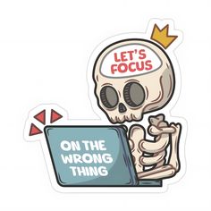 a sticker that says, let's focus on the wrong thing in front of a laptop