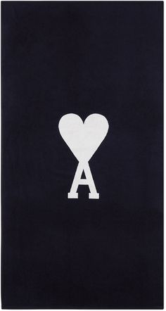 a black towel with a white heart and letter a in the middle on top of it