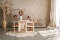 a living room with two tables and plants in the corner next to each other on a rug