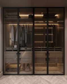 an empty walk in closet with glass doors