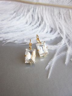 "These elegant sparkly little earrings are made with fine Swarovski crystals in fancy step cut rectangle shape. Available in gold, rose gold or silver finish. Timeless understated elegance perfect for any occasion. Matching necklace and bracelet is also available. - Measurements: 7/8\" long from the top of the ear wire to the bottom of the earring and 3/8\" wide" Rose Gold Wedding Earrings, Gold Wedding Earrings, Long Bridal Earrings, Crystal Bridal Earrings, Bridal Earrings Drop, Gold Bridal Earrings, Jewelry Accessories Ideas, Step Cut, Classy Jewelry