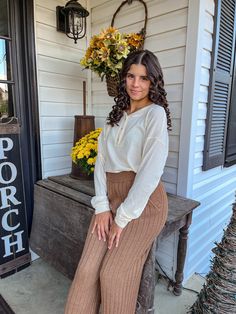 Waffle knit sweater top Front button detail Round neckline Long sleeves 95% Polyester/5% Spandex