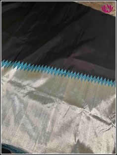 Presenting you Kanchipuram silk saree in black and blue. The body of the saree showcases a striking contrast between the deep black and rich blue hues, creating a captivating visual impact. The highlight of this saree is the exquisite silver tissue temple border. The rising pattern of the border adds a sense of grandeur and sophistication. The silver tissue material lends a subtle shimmer to the saree, adding a touch of glamour to its traditional appeal. This saree exudes grace and poise, making Thread Knots, Saree In Black, Kanchipuram Silk Saree, Pure Silk Sarees, Deep Black, The Deep, Blue Hues, Mulberry Silk, Pure Silk