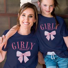 Unleash your girly side with the Girly Mama & Mini Tees. Featuring adorable bows and perfect for matching with your mini me, these tees are made for the ultimate girly duo. Perfect for moms and daughters who love to have fun and look cute! Design is Printed Direct to Garment. Pink Matching Top For Gender Reveal, Fun Pink Tops For Family Occasions, Cute Pink Tops For Family Occasions, Playful Pink Tops For Mother's Day, Cute Cotton T-shirt With Pink Bow, Mother's Day Gift Top, Cute Blue Tops For Mother's Day, Mini Tees, Moms And Daughters