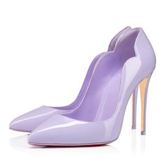 a pair of purple high heel shoes on a white surface with the bottom part showing