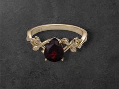 ✨ Introducing our stunning 925 Sterling Silver Natural Garnet Ring! ✨  Crafted with love and care, this beautiful ring features a gorgeous pear-shaped garnet that radiates a rich, vibrant red color, symbolizing passion and love. Set in a luxurious 925 sterling silver band with a touch of gold, this ring is perfect for any occasion--whether it's a special event or a little treat for yourself! 💖 🤩 Why You'll Love It: Handmade Quality: Each ring is meticulously crafted for a unique touch. Vibrant Red Gemstones, Garnet Ring, Touch Of Gold, Garnet Rings, Beautiful Ring, Sterling Silver Bands, High Quality Jewelry, Vibrant Red, Silver Band