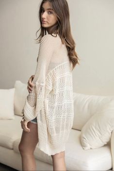 Stay effortlessly cool and boho chic with this Cream Knit Netted Cardigan! Lightweight and perfect for layering, this cardigan will be your go-to piece to turn up the heat on your style game when the sun's out. Layer it up and show off your fashionable flair! 100% Polyester One size: approximately 0-16 Length: 30" Bust Across: 24.5" Sleeve Length: 12" Sleeve Opening: 5.75" Gilet Kimono, Cardigan Kimono, Boho Cardigan, Kimono Duster, Oversize Sleeves, Summer Sweaters, Capes For Women, Womens Kimono, Poncho Sweater