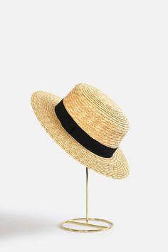 Bring classically chic flair to your summer look with the Abella Classic French Boater Hat. This classic French accessory is made from breathable straw and designed with an adjustable pull string for the perfect fit. You'll love the elegant aesthetic this piece adds to any ensemble.Head circumference: 55.5cm (designed with adjustable pull string for the perfect fit)Your purchase can also be made at:www.enbelleepoque.com Chic Spring Boater Hat Made Of Paper Straw, Adjustable Black Straw Hat Made Of Paper Straw, Flat Brim Straw Hat For Picnic, Elegant Brimmed Straw Hat Made Of Paper Straw, Classic Straw Bucket Hat For Vacation, Adjustable Woven Straw Hat For Summer, Chic Beach Boater Hat, Chic Straw Boater Hat For Beach, Classic Adjustable Straw Hat