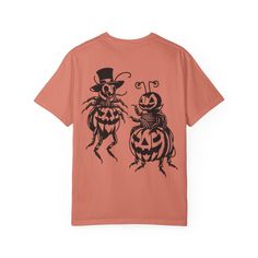 This comfort Colors tee made 100% with ring-spun cotton features a small pumpkin on the front and two bugs dressed up for halloween on the back! The soft-washed, garment-dyed fabric brings extra coziness to your wardrobe while the relaxed fit makes it an excellent daily choice. The double-needle stitching throughout the tee makes it highly durable while the lack of side-seams helps the shirt retain its tubular shape.  The Comfort Colors tee is made with medium fabric (6.1 oz/yd; (206.8 g/m)) consisting of high quality, 100% ring-spun US cotton for long-lasting comfort. The relaxed fit keeps the wearer comfy in both casual and semi-formal settings while the crew neckline delivers that classic, neat style which makes it perfect for accessorizing.  The pre-shrunk fabric ensures a consistently Fun Graphic Print T-shirt For Costume Party, Crew Neck Graphic Print T-shirt For Costume Party, Graphic Print Crew Neck T-shirt For Costume Party, Themed Short Sleeve T-shirt For Costume Party, Casual Crew Neck T-shirt For Costume Party, Novelty Short Sleeve T-shirt For Costume Party, Novelty T-shirt For Costume Party With Short Sleeves, Bug Dress, Small Pumpkins