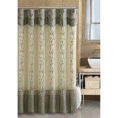 a shower curtain with flowers on it in a bathroom