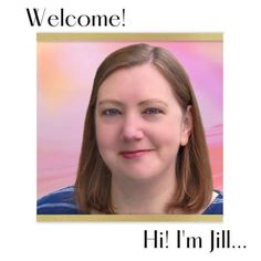 a woman is smiling for the camera and has a welcome sign in front of her