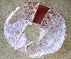 a red and white bandana laying on top of a floor