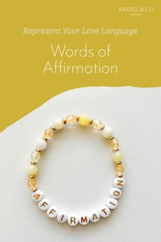 Krizel & Co's Love Language 💛 Collection, featuring our "Words of Affirmation" bracelet. This language centers around compliments and sincere words that celebrate the beauty of connection. ☀️🌻 #lovelanguages #wordsofaffirmation #krizelandco #jewelrybrand #lifesylebrand #braceletaesthetic Inspirational Adjustable Beaded Bracelets, Everyday Meaningful Beaded Bracelets, Inspirational Beaded Bracelets For Gifts, Inspirational Handmade Stretch Bracelet, Personalized Inspirational Beaded Bracelets, Inspirational Adjustable Hypoallergenic Beaded Bracelets, Inspirational Beaded Bracelets For Everyday, Inspirational Round Beads Bracelet As A Gift, Everyday Inspirational Round Bead Jewelry