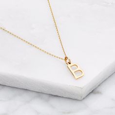 Solid Gold Small Initial Letter Charm Necklace | Lily & Roo | Wolf & Badger Minimalist Yellow Gold Initial Pendant Necklace, Yellow Gold Monogram Initial Necklace, Dainty Yellow Gold Monogram Initial Necklace, Dainty Yellow Gold Initial Pendant Necklace, Yellow Gold Charm Necklace With Initial Pendant, Gold Initial Necklaces, Diamond Moon Necklace, Baguette Diamond Necklace, Double Horn Necklace