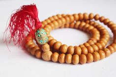 This is Very fine bodhi Seed mala from Nepal with Great Tassel and Inlay Beads. 108 Beads Mala are Buddhist Prayer beads that Used for Yoga or Meditation. Use It for you Good Luck. 11-12mm Size Tyre Shape Beads. 24 Inch Long Meditation Buddha Shop For Nepali handmade Products. We Supports Small Family Artisans who create a Beautiful handmade rituals Products. Traditional Gemstone Beads Mala For Festival, Traditional Festival Mala With Gemstone Beads, Traditional Large Beads Mala For Meditation, Traditional Mala With Large Beads For Meditation, Rituals Products, Nepal Jewelry, Meditation Buddha, Buddhist Mala, Knotted Mala