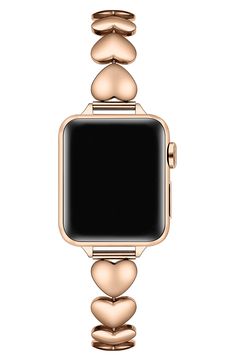 an apple watch with gold rings and hearts on the face, against a white background