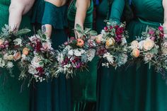 the bridesmaids are holding their bouquets in their hands and wearing green dresses