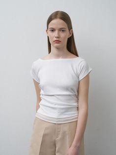 This product, called the Junis T-Shirt, presents a staple garment with a refined twist. It features a boat neck and subtle cap sleeves, elevating the traditional T-shirt design to a more polished level. The soft, stretchable fabric ensures a comfortable fit that gracefully skims the body, making it a versatile piece for both casual and smart-casual ensembles. - The Junis T-Shirt is designed with a boat neckline, offering an elegant take on a classic wardrobe essential.- Cap sleeves add a delicate, feminine touch to the overall design, making it a standout piece.- The T-shirt is cut from a high-quality, soft fabric that provides both comfort and durability.- Its snug fit and simplistic design make it a perfect layering piece or a sleek top to wear on its own. Classic Wardrobe Essentials, Delicate Feminine, Simplistic Design, Classic Wardrobe, Overall Design, Technical Drawing, Boat Neckline, Layering Pieces, Boat Neck