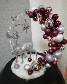 a christmas decoration on top of a black table