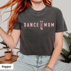 Dance mom shirt for all of the mamas of little ballerinas :) Printed on trendy and relaxed fit Comfort Color t-shirts. Makes a great Mother's Day, birthday, or Christmas gift for her! ✨ Free shipping!✨  Product color may vary slightly due to variation in photographic lighting and screens/monitors displaying colors differently. The design's scale may be different between sizes since the available print area varies based on the size of the tee. When ordering and choosing your size, please keep the Casual Short Sleeve T-shirt For Dance, Casual Cotton T-shirt For Dance Class, Black Summer Top For Dance Class, Casual Summer T-shirt For Dance, Casual Cotton T-shirt For Dance, Casual Summer Dance T-shirt, Summer Casual T-shirt For Dance, Casual Short Sleeve Dance Tops, Casual Short Sleeve Tops For Dance