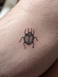 Stick and poke bug tattoo House Stick And Poke, Stick And Poke Nature, Bug Stick N Poke, Leg Tattoos Stick And Poke, Tiny Beetle Tattoo, Cute Beetle Tattoo, Beetle Stick And Poke, Simple Beetle Tattoo, Bug Stick And Poke