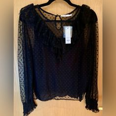 Type 94% Nylon 6% Spandex Lining- 100% Rayon Pull On Round Neck,Short Sleeve, Loose Fit, Sheer Overlay Blouse. Pit-To-Pit: 22.5” Length: 23” Chic Black Swiss Dot Top, Overlay Blouse, Black Camisole, Sheer Overlay, Mesh Overlay, Black Dots, Round Neck, Loose Fitting, Dots