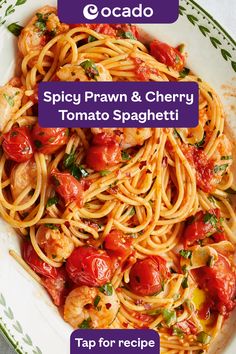 spaghetti with shrimp and cherry tomatoes served in a white bowl