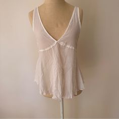 Nwot. Never Worn. Brand New. Super Cute Lightweight Flouncy Tank Made Out Of Gauzy Type Material. Cute With Lace Or Chain Bra Underneath Unlined Summer Tops, Unlined Summer Daywear Tops, Unlined Summer Tops For Daywear, Unlined Tops For Summer Daywear, Casual Sheer Top For Vacation, Unlined Spring V-neck Top, Chic Unlined Top For Daywear, Sheer Tops For Loungewear, Casual Unlined Tops